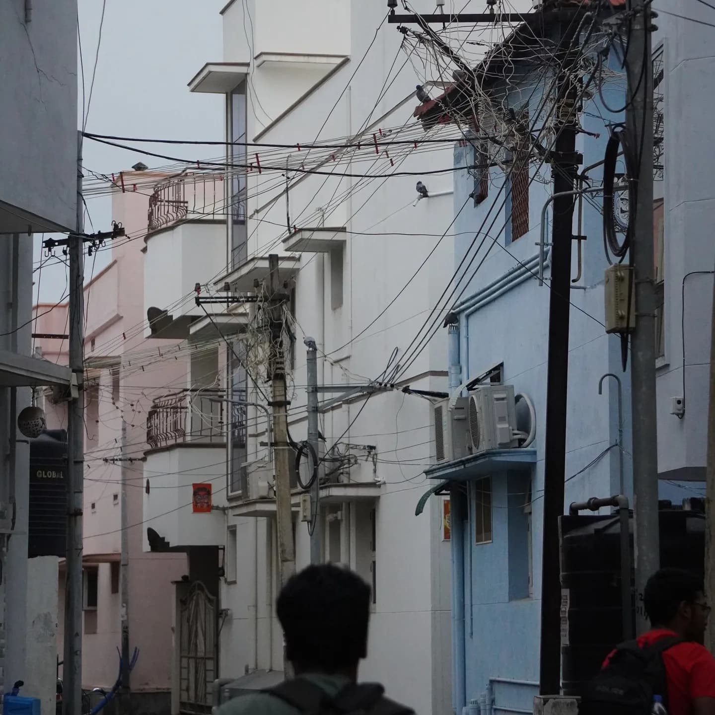 Pastel walls and a mess of power lines