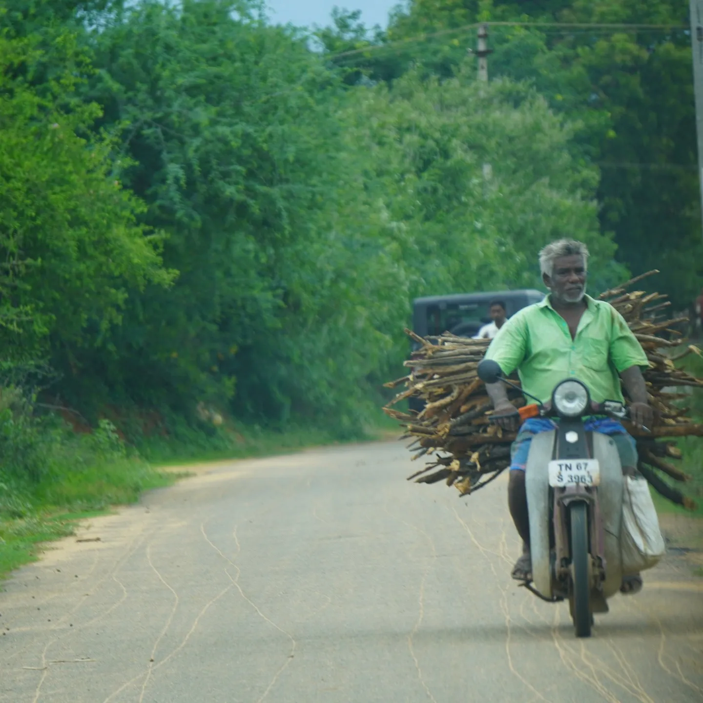 Someone's firewood, heading home on a moped