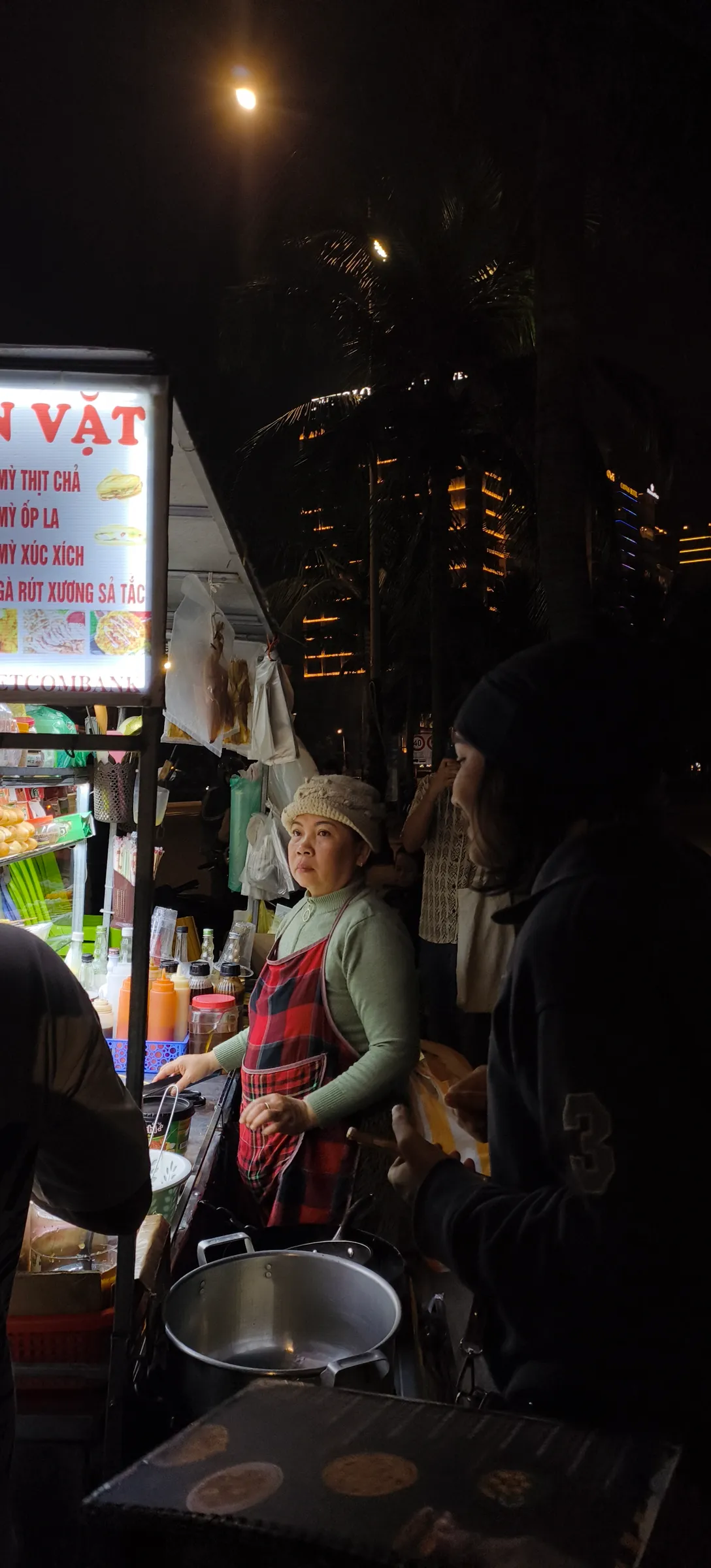 A late-night snack stall and the woman who runs it