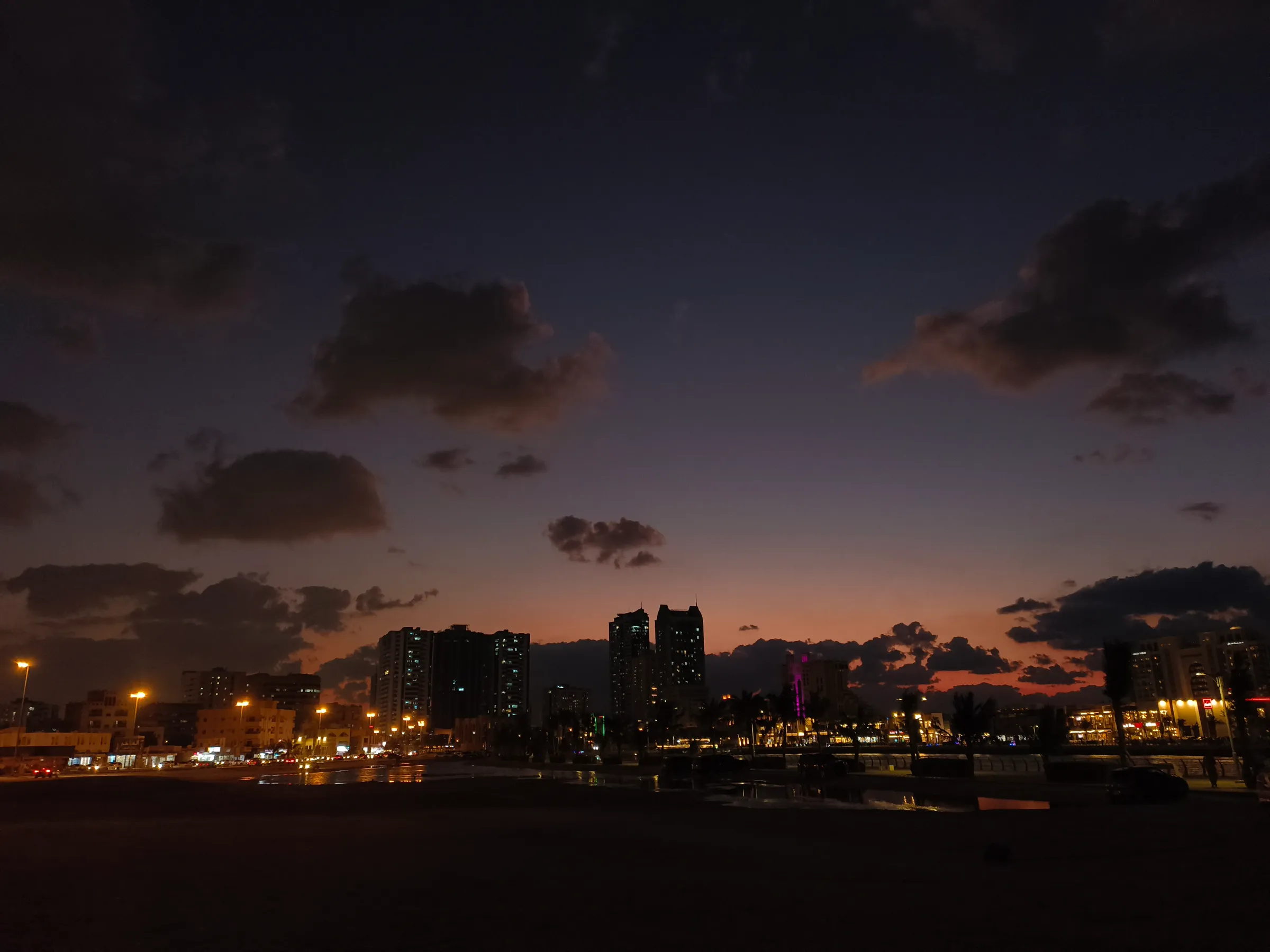 The city lights coming on after sunset